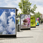 billboards with photographs at city street